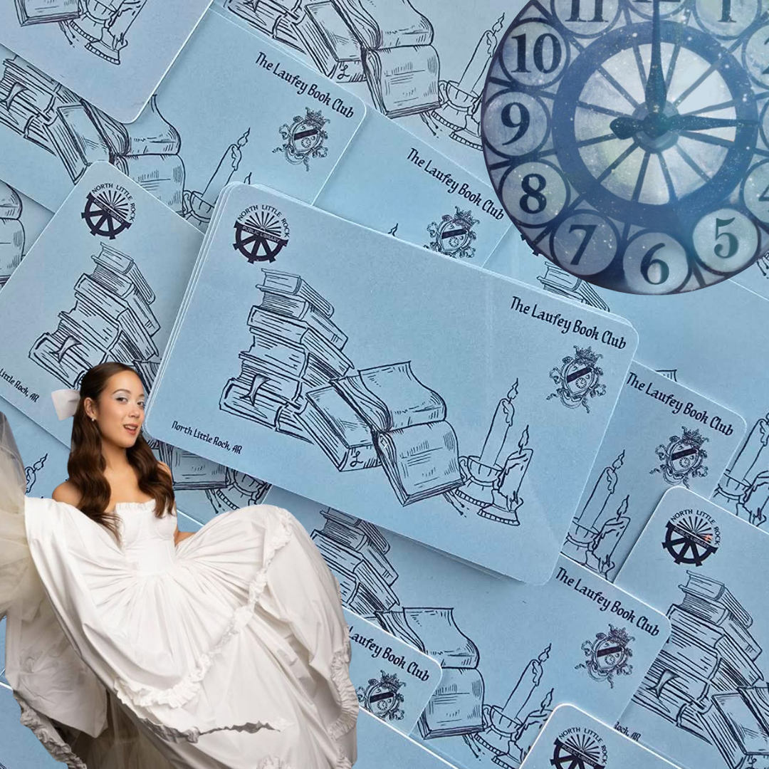 Laufey in a white ball gown poses in front of a fanned-out collection of Laufey Book Club library cards featuring stacked books and a candle illustration, with a clock face in the background.