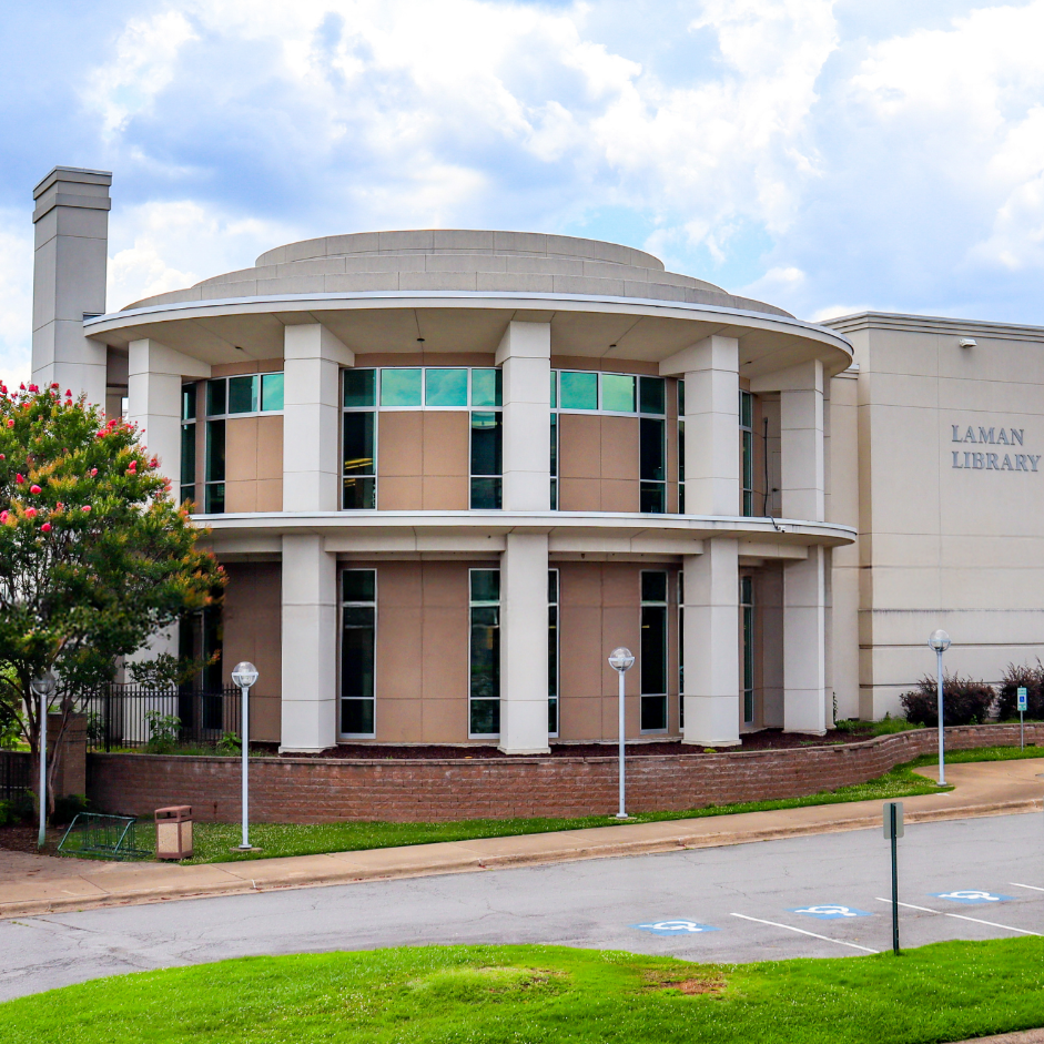Laman Library's branch building with columns surrounding the rotunda on a clear sky day. Located at 2801 Orange St., North Little Rock, Arkansas