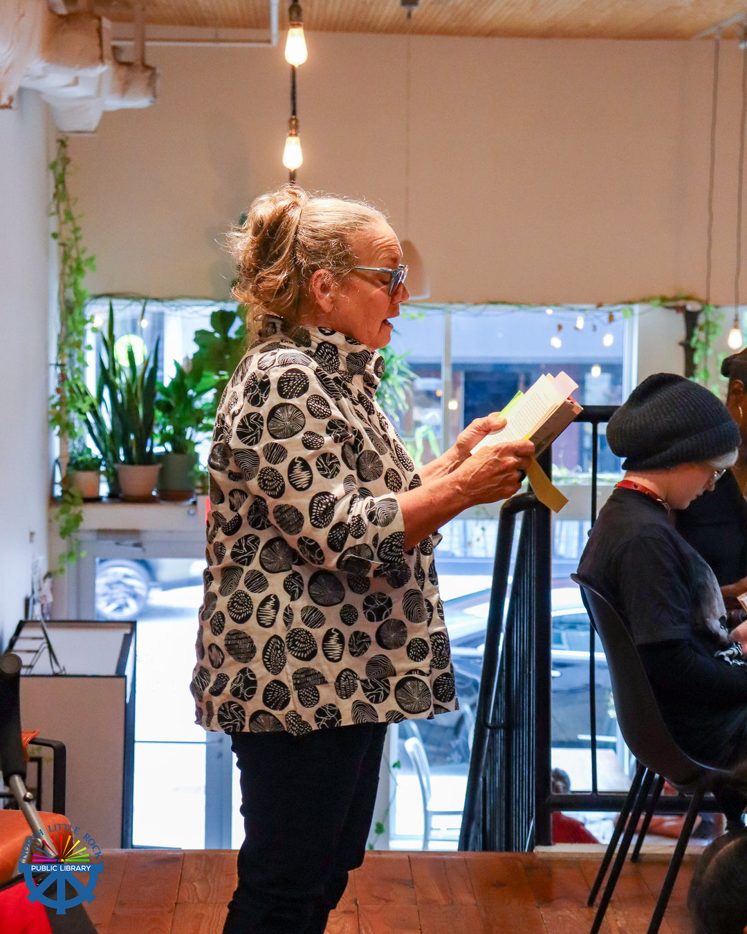 Jennie reading her favorite passage from the one community one book selection.