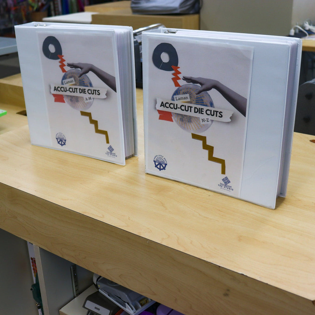 Binders containing images of dies in the library's collection.