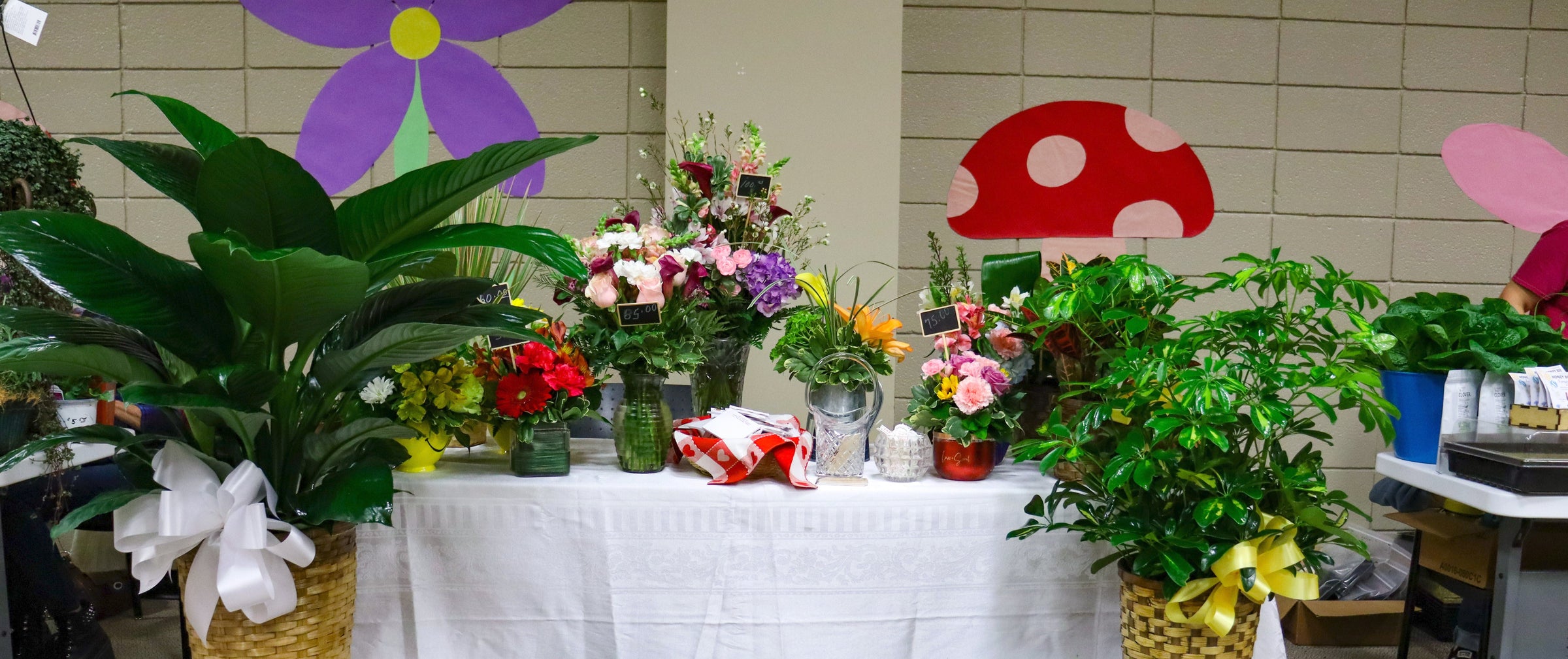 Decorative table with colorful plants and flowers.