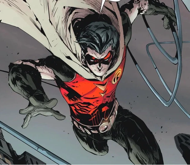 Comic book character Robin, wearing a red and black outfit with a gray cape, soars through the air holding a weapon.