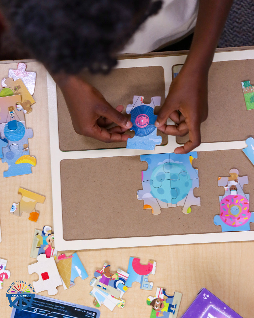 A child putting together a puzzle.