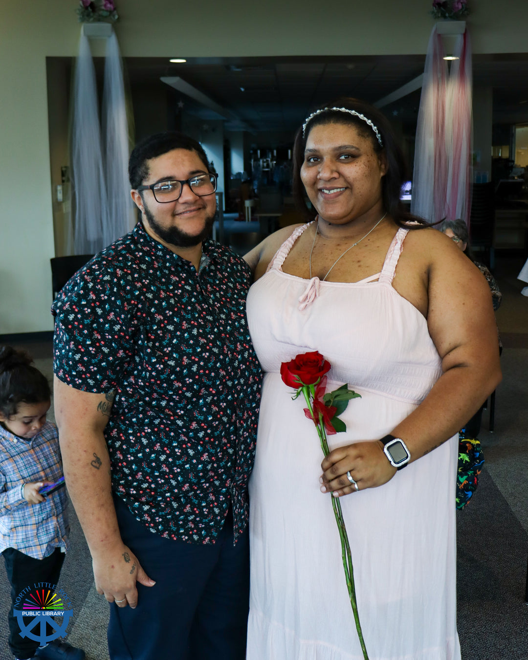 Two people in wedding attire after their vow renewal.