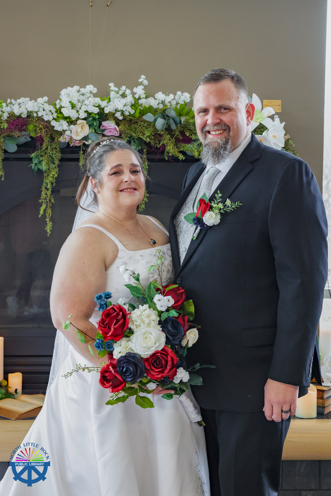 A couple in wedding attire with a colorful bouquet after their marriage ceremony.