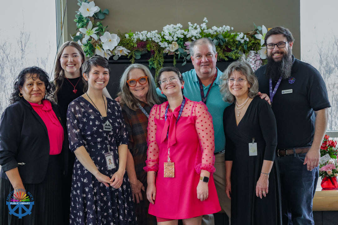A group of 8 library employees who coordinated the Valentine's Day wedding.